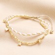 Neutral and Gold Cord Double Layer Beaded Bracelet in Gold  on a neutral background