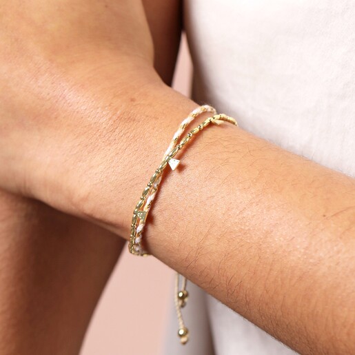 close up of bracelet on model Neutral and Gold Cord Double Layer Beaded Bracelet in Gold on a model