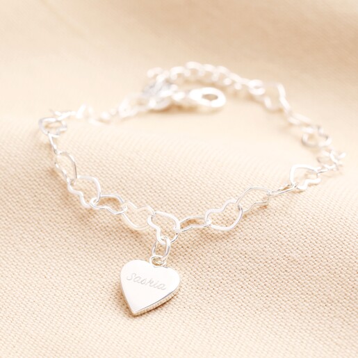 Personalised Name Heart Chain Bracelet in Silver on a Beige Background