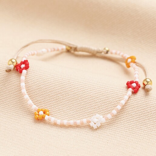 A peach and white alternating beaded bracelet.