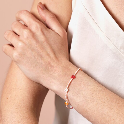 Model Shot of Pull Cord Red and Orange Daisy Beaded Bracelet 