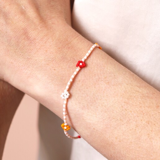 Close Up Model Shot of Pull Cord Red and Orange Daisy Beaded Bracelet on Model