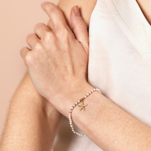 Model Shot Model Shot of Stainless Steel Beaded Pearl Starfish Pendant Bracelet in Gold