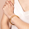 Model Shot of Stainless Steel Chunky Bangle in Gold