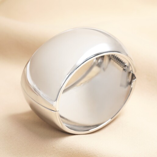 An oversized bangle bracelet in silver