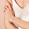 Model Shot of Stainless Steel Double Layer Dolphin Charm Bracelet in Gold
