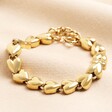 A gold plated heart chain bracelet With repeating heart-shaped beads