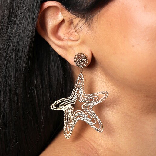 On model Oversized Hammered Starfish Outline Drop Earrings in Gold on model