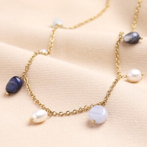 Semi Precious Blue Bead and Pearl Charm Necklace in Gold