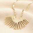 Stainless Steel Fringe Pendant Long Necklace in Gold on a neutral background