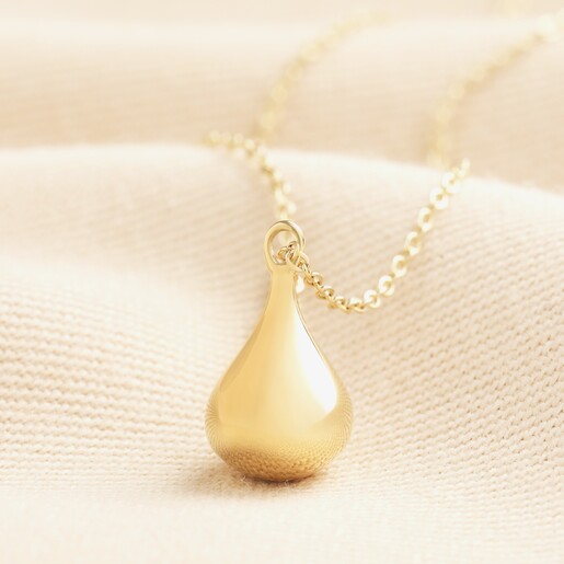 Stainless Steel Wide Teardrop Necklace in Gold Stainless Steel Wide Teardrop Necklace in Gold on a neutral background