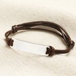 Sterling Silver Mens Plaque Cord Bracelet on a neutral background