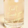 Close Up of the Can't Thank You Enough Pink Gin on a Beige Background