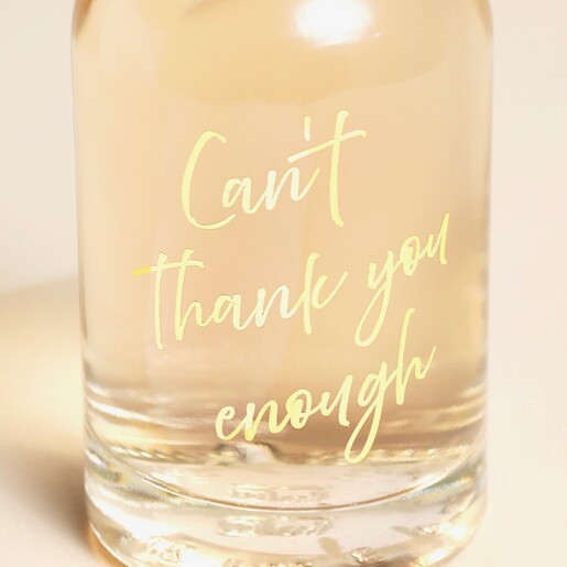 Close Up of the Can't Thank You Enough Pink Gin on a Beige Background