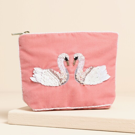 A beaded swan pouch with a white bead outline