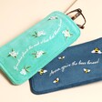 A glasses case with nature-based illustrations