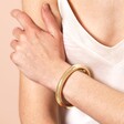 Model Shot of Thick Open Chunky Torque Bangle in Gold