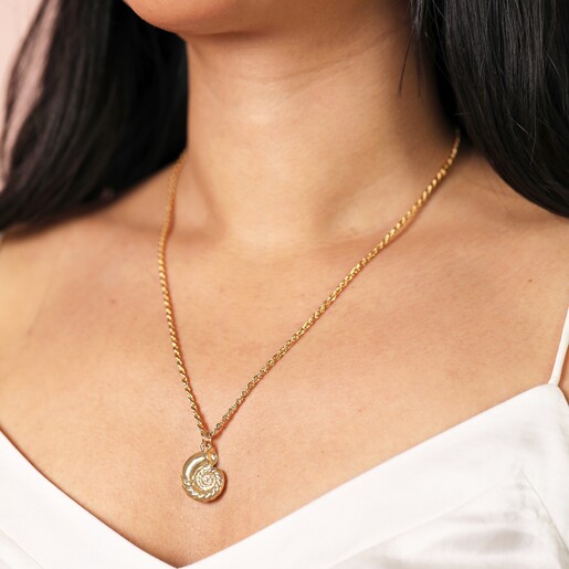 Close Up of Model Close Up of Swirl Shell Pendant Necklace in Gold on Model