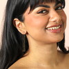 Bar and Hanging Chain Drop Earrings in Gold on a model