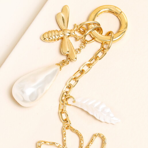 close up of pearl charm and circle clasp fastening