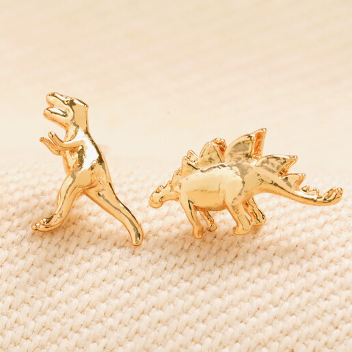 close-up of dinosaur stud earrings