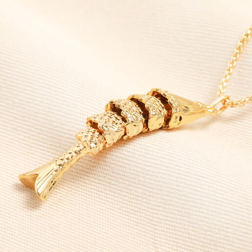 antique fish pendant with textured body in gold