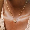 flower charm necklace with a satellite chain in gold
