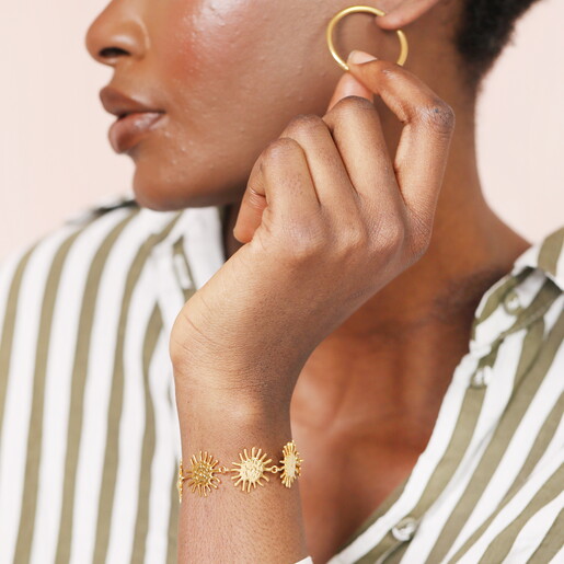 A Chunky Chain Bracelet with Gold Sun-Shaped Links and a Sliding Toggle Clasp Feature
