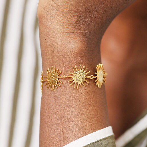A Chunky Chain Bracelet with Gold Sun-Shaped Links and a Sliding Toggle Clasp Feature