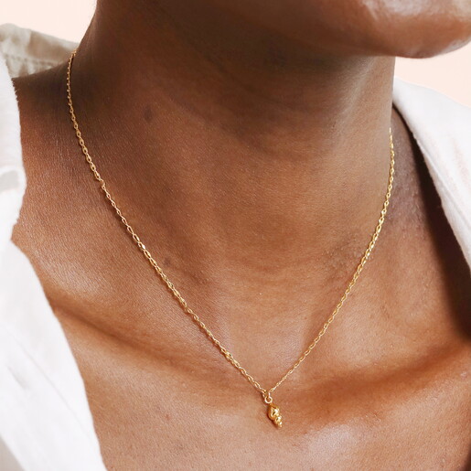 tiny conch shell pendant necklace in gold