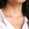 tiny conch pendant necklace in silver close up on model