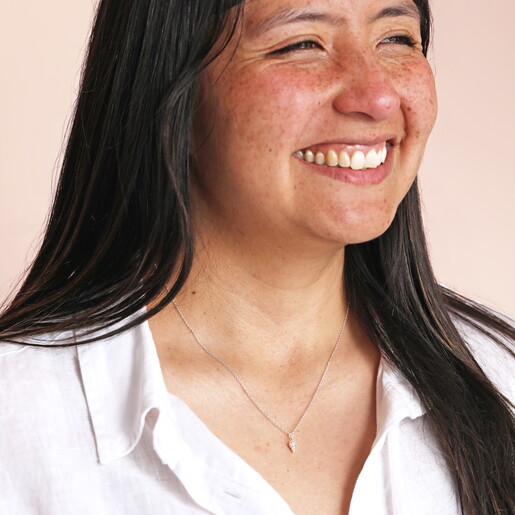 tiny conch pendant necklace in silver on model