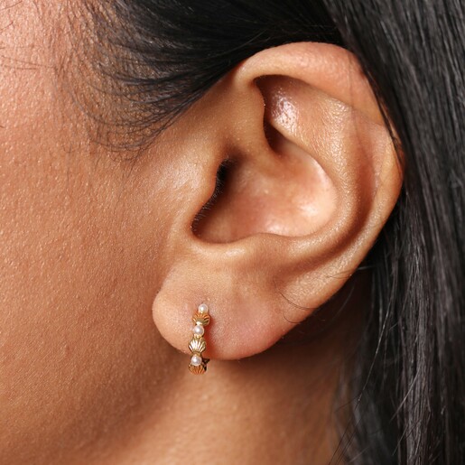 Pearl and Shell Huggie Hoop Earrings in Gold on model