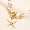 close up of starfish pendant in gold 