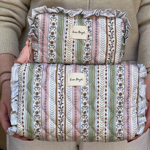 A quilted floral wash bag in sage and pink lifestyle shot