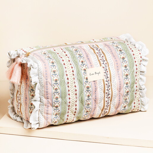 A quilted floral wash bag in sage and pink