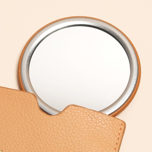 single circular mirror with silver metal detailing