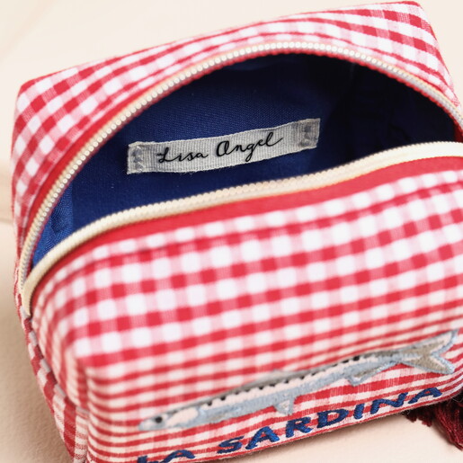 inside of red and white fish pouch