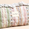 close up of Lisa Angel logo against pattern fabric