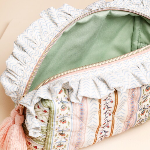 sage green interior of quilted washbag