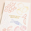 Close Up of Cover on Cream Linen Favourite Recipes Cookbook Journal