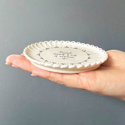 white ceramic coaster with scalloped edge