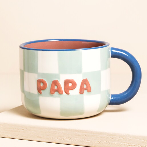 white and blue ceramic papa mug