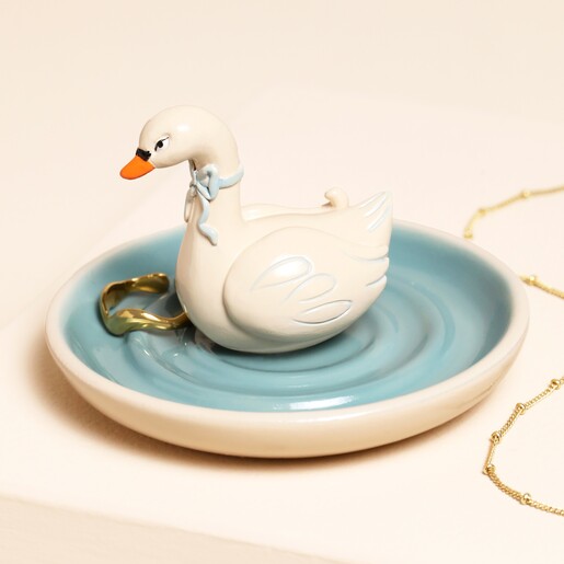 swan ring holder on a rippled pond
