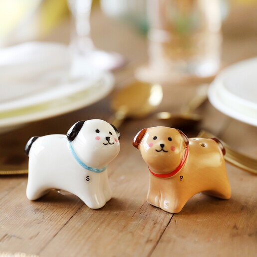 white and orange salt and pepper shakers