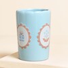 ceramic tumbler with floral design in blue
