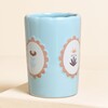 blue ceramic tumbler with floral design