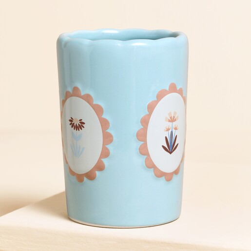 blue ceramic tumbler with floral design