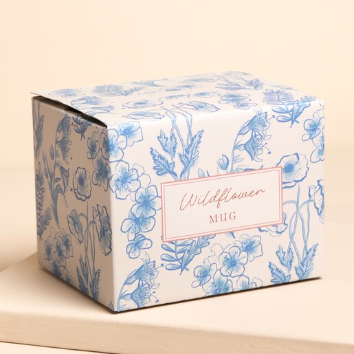 floral packaging against pale pink background