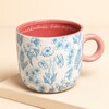 floral blue mug against pale pink background